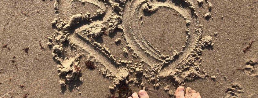 RO - Skrevet i sandet på en strand