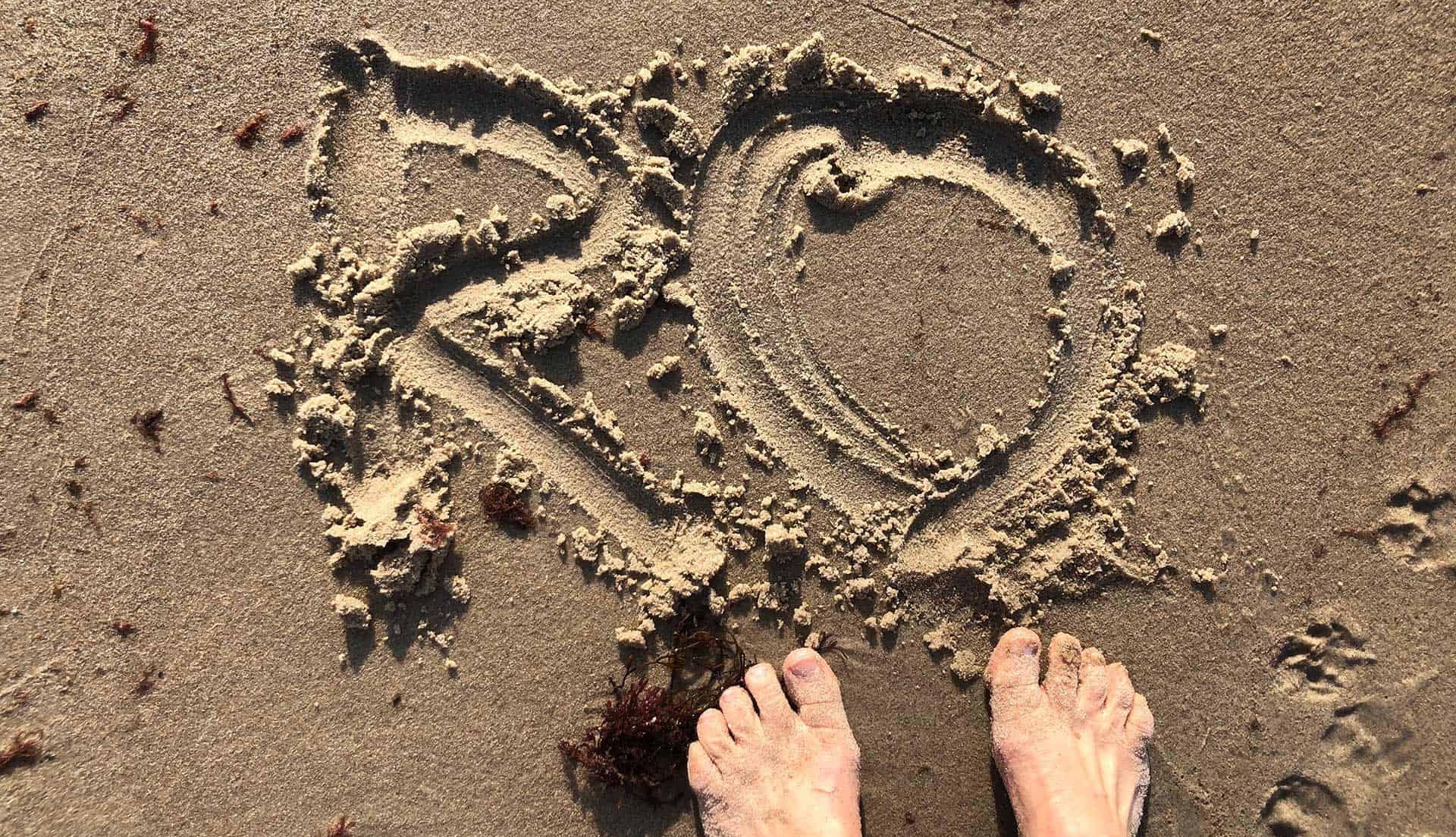 RO - Skrevet i sandet på en strand