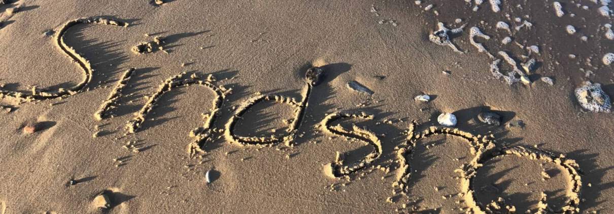 sindsro skrevet i sand